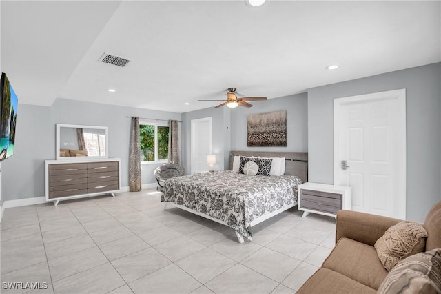 tiled bedroom with ceiling fan