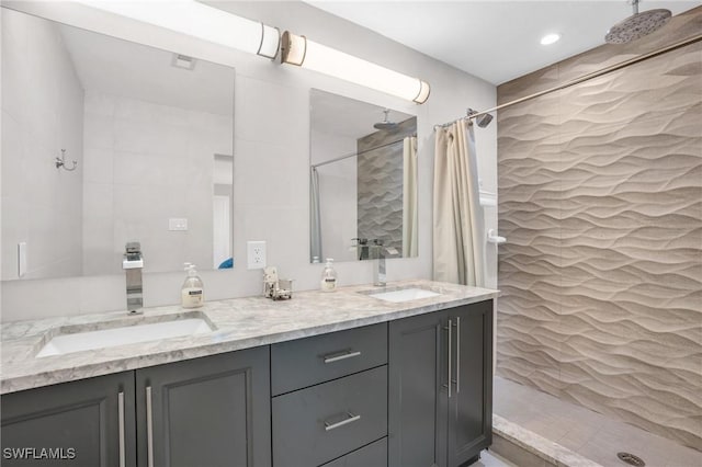 bathroom with vanity and walk in shower