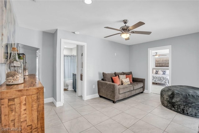 tiled living room with ceiling fan