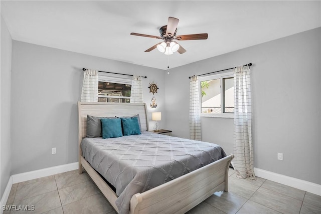 tiled bedroom with ceiling fan