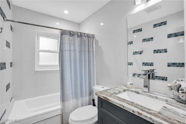 full bathroom with toilet, vanity, and shower / bathtub combination with curtain