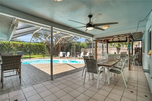 view of patio featuring a fenced in pool, a lanai, and ceiling fan