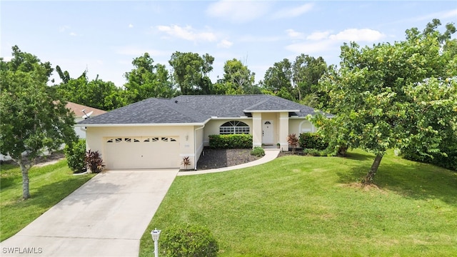 single story home featuring a garage and a front yard