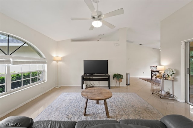 tiled living room featuring ceiling fan and lofted ceiling