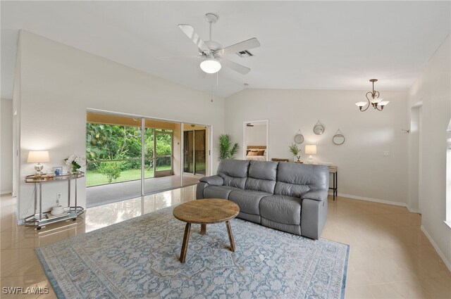 tiled living room featuring ceiling fan with notable chandelier and vaulted ceiling