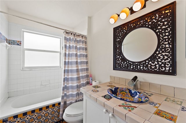 full bathroom featuring vanity, shower / tub combo, and toilet