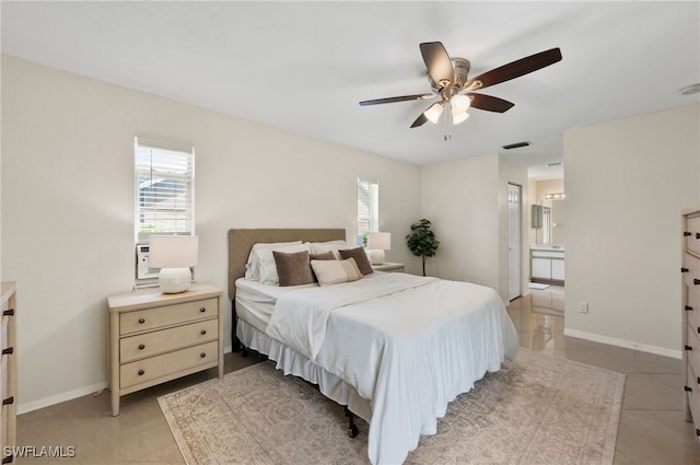 bedroom featuring ensuite bathroom and ceiling fan