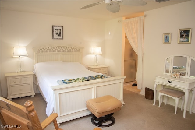 bedroom featuring ceiling fan and dark colored carpet