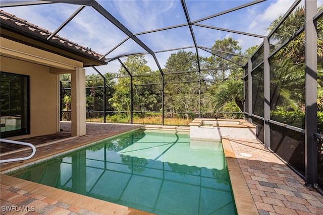 view of pool with a lanai