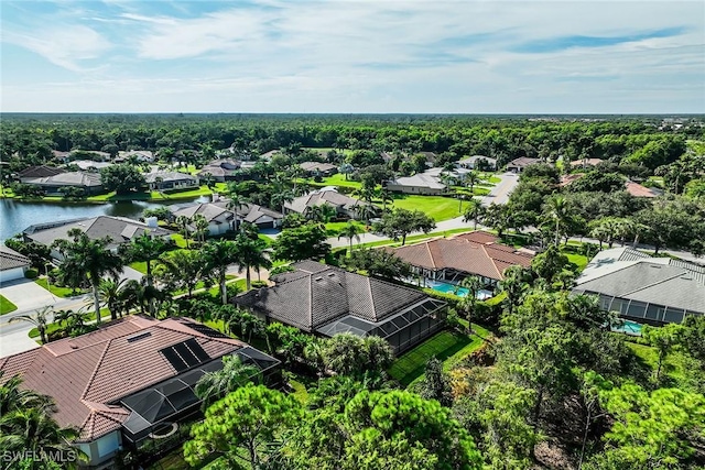 birds eye view of property featuring a water view and a residential view