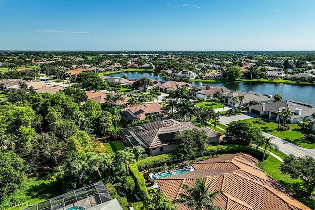 birds eye view of property with a water view and a residential view