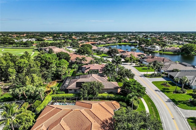 drone / aerial view with a water view and a residential view