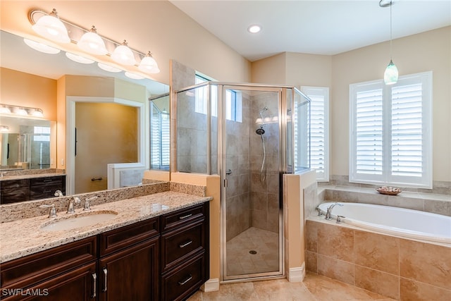 bathroom with tile patterned flooring, plus walk in shower, and vanity