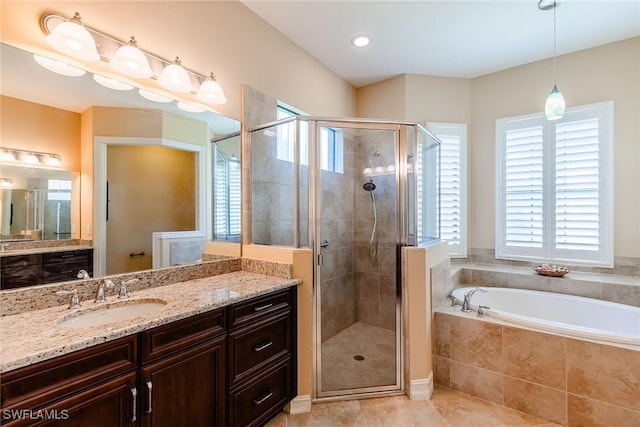 bathroom with tile patterned floors, a shower stall, vanity, and a bath