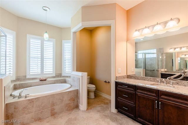 full bath with tile patterned flooring, a garden tub, toilet, vanity, and a stall shower