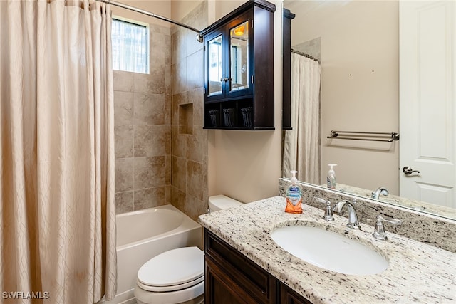 full bathroom with toilet, shower / tub combo with curtain, and vanity