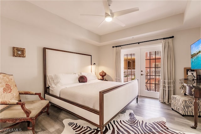 bedroom with ceiling fan, light wood-type flooring, access to outside, and french doors