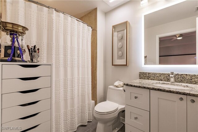 bathroom featuring tile patterned floors, ceiling fan, vanity, and toilet