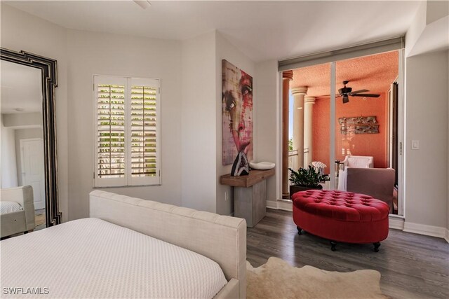 bedroom with dark hardwood / wood-style flooring