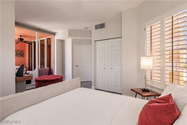 bedroom featuring wood-type flooring and a closet