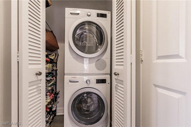 laundry room featuring stacked washer / dryer