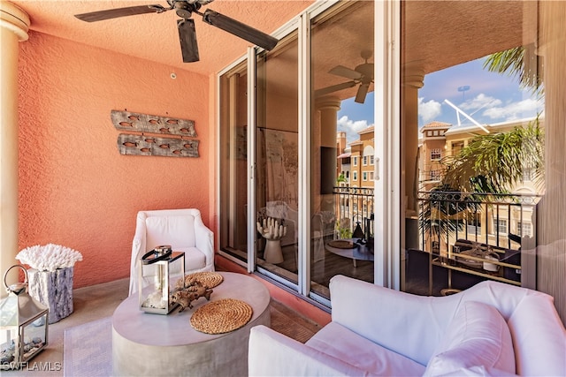 balcony featuring ceiling fan and french doors