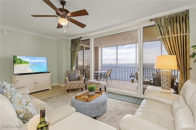 living room featuring a wall of windows, light tile patterned flooring, ornamental molding, and ceiling fan