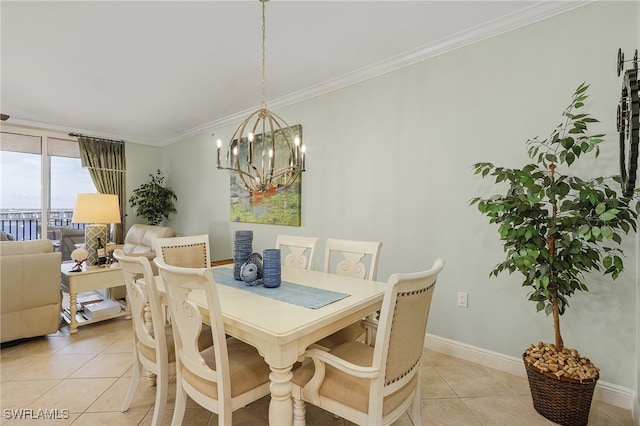 tiled dining area featuring a notable chandelier and crown molding