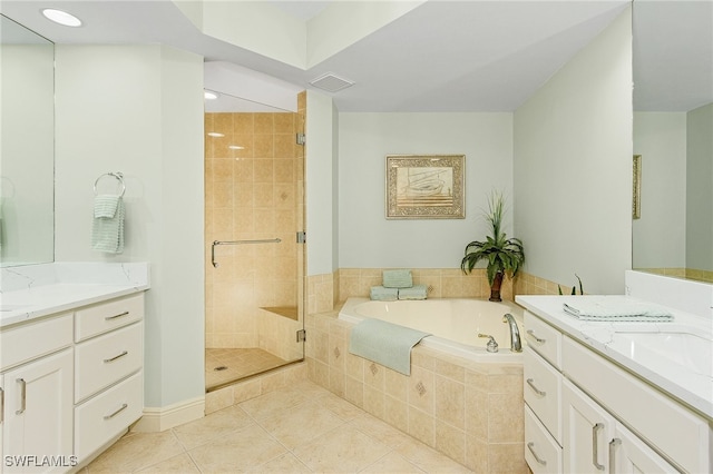 bathroom featuring shower with separate bathtub, double vanity, and tile patterned floors