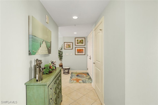 corridor with light tile patterned flooring