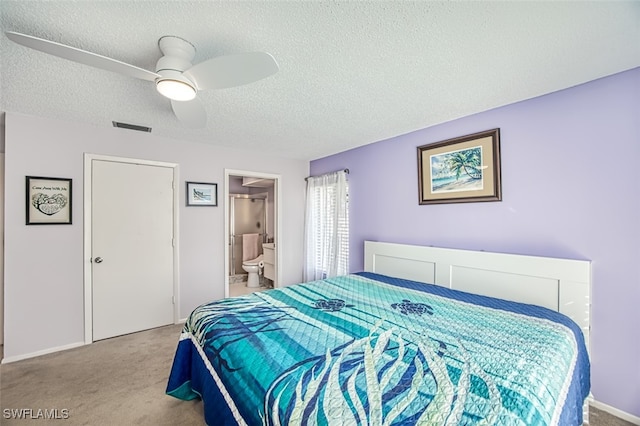 bedroom with ensuite bath, ceiling fan, light carpet, and a textured ceiling