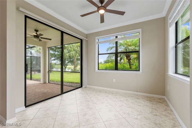 tiled spare room with ceiling fan and crown molding