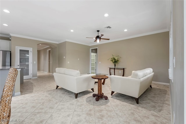 living room featuring crown molding, ceiling fan, and light tile patterned floors