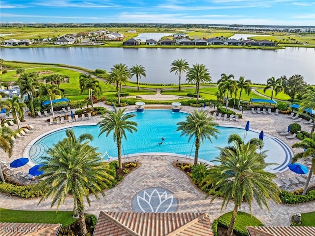 view of swimming pool with a water view