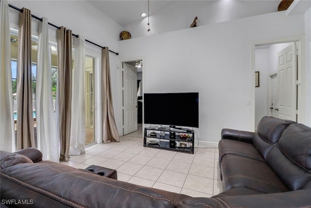 living room featuring light tile patterned floors and lofted ceiling