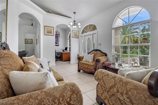 tiled living room featuring an inviting chandelier