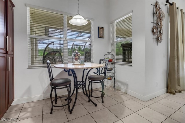 3711 4th Ave SE, Naples, FL 34117 - dining room featuring light tile patterned floors and baseboards