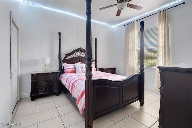 tiled bedroom featuring ceiling fan