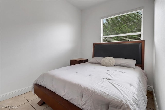 3711 4th Ave SE, Naples, FL 34117 - tiled bedroom featuring baseboards