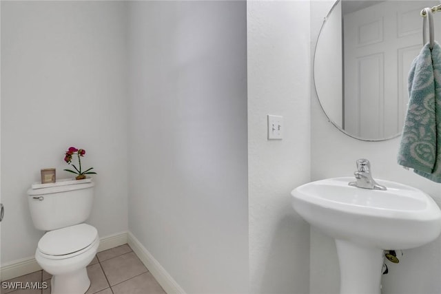 3711 4th Ave SE, Naples, FL 34117 - bathroom featuring toilet, tile patterned flooring, baseboards, and a sink