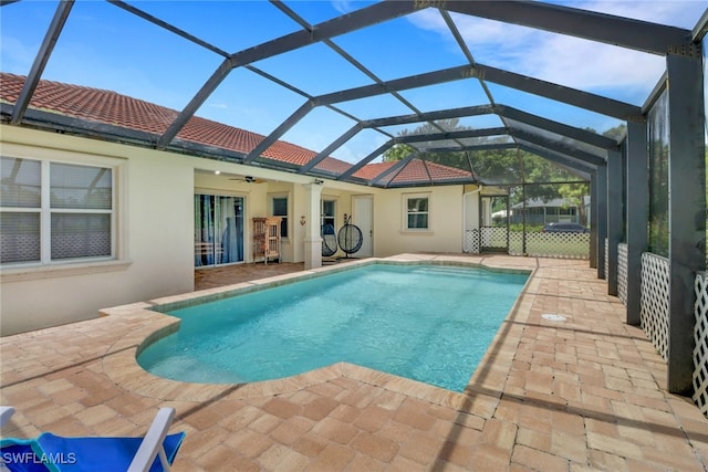 3711 4th Ave SE, Naples, FL 34117 - outdoor pool with ceiling fan, a patio area, and glass enclosure