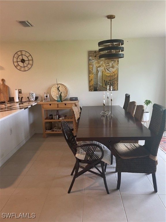 dining area featuring light tile patterned flooring