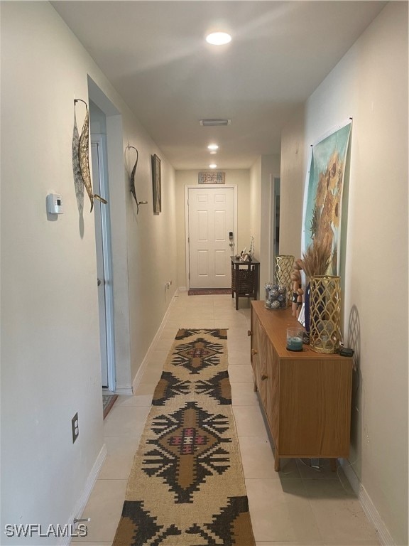 hallway with light tile patterned flooring