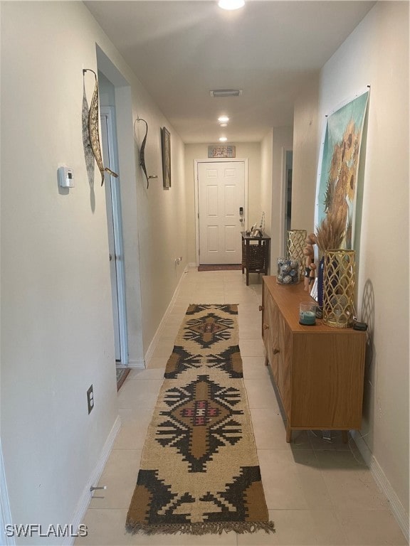 hallway with light tile patterned floors