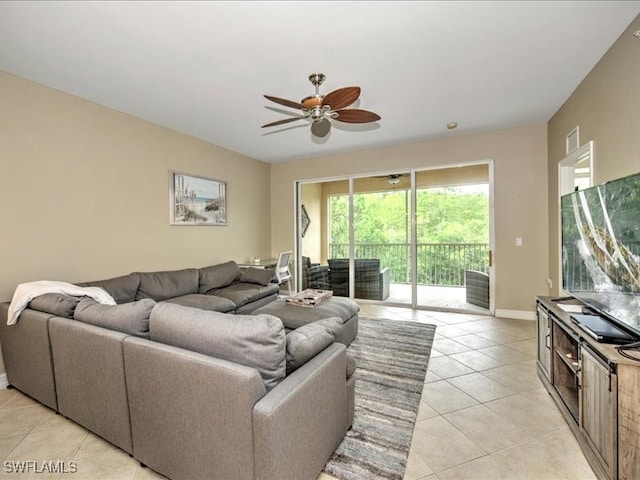 tiled living room featuring ceiling fan