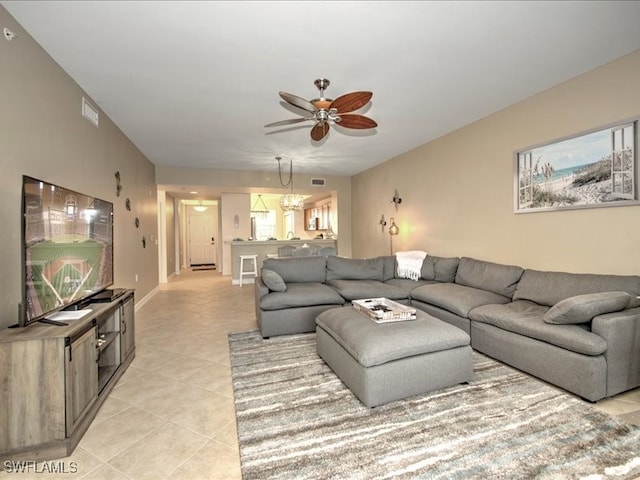 tiled living room with ceiling fan