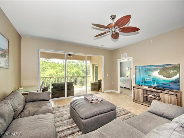 living room with light tile patterned flooring and ceiling fan