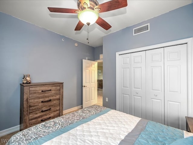 bedroom with ceiling fan, a closet, and carpet floors