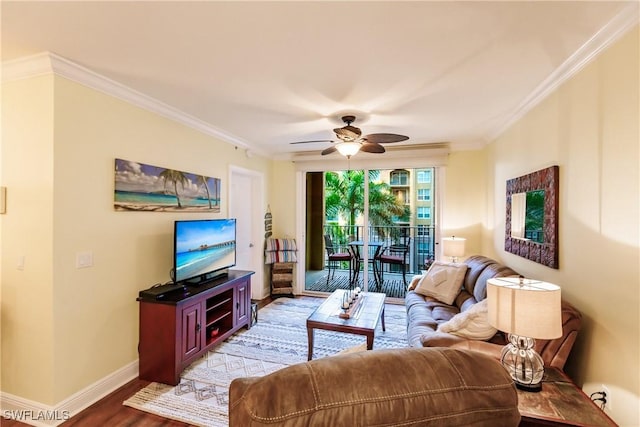 living room featuring ceiling fan, crown molding, and light hardwood / wood-style floors