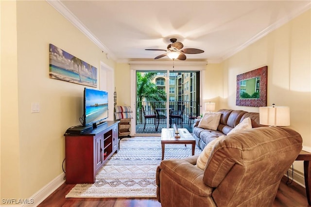 living room featuring dark hardwood / wood-style floors, ceiling fan, and ornamental molding